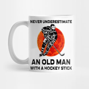 NEVER UNDERESTIMATE AN OLD MAN WITH A HOCKEY STICK Mug